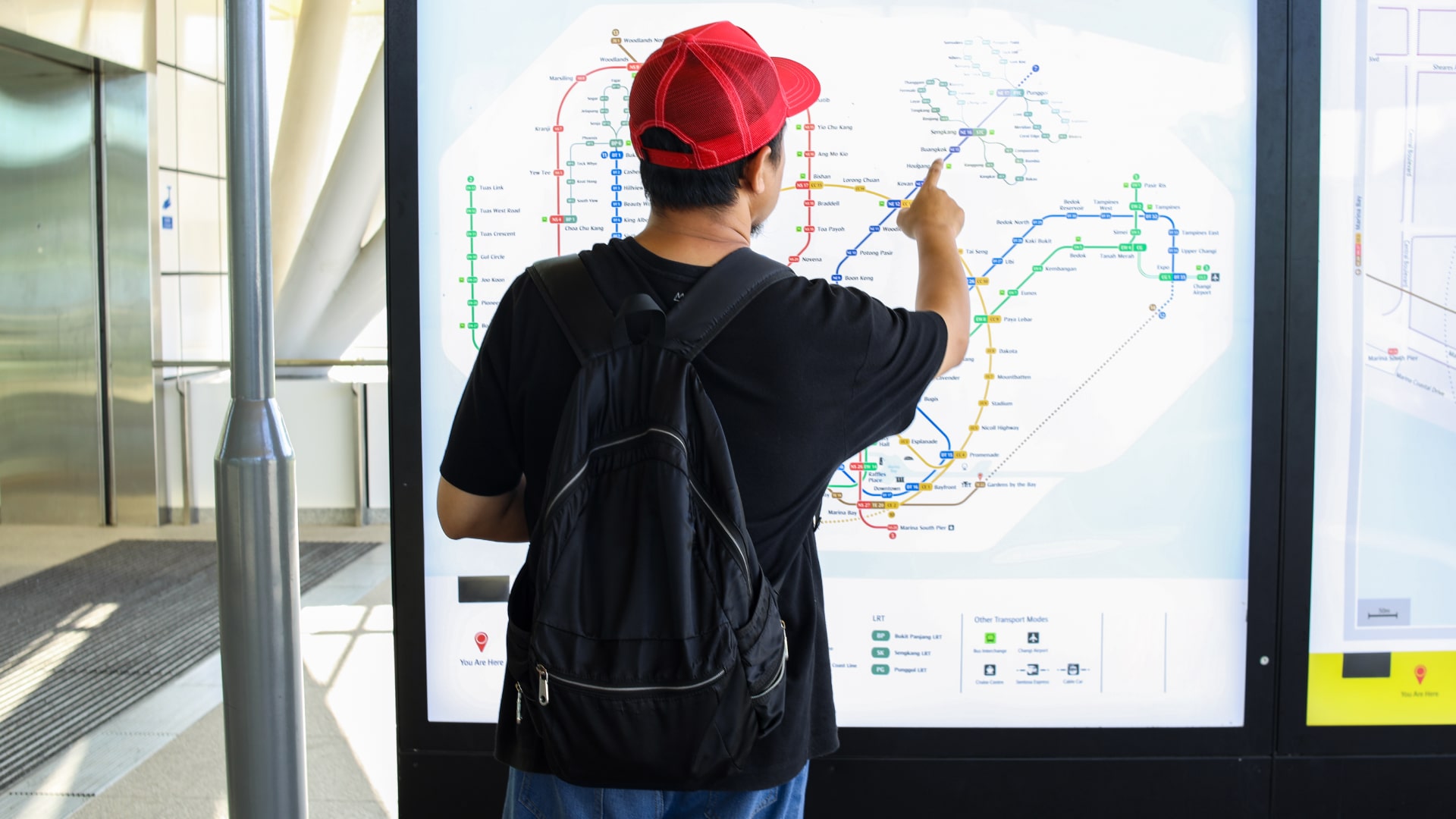 Man looking at metro station map