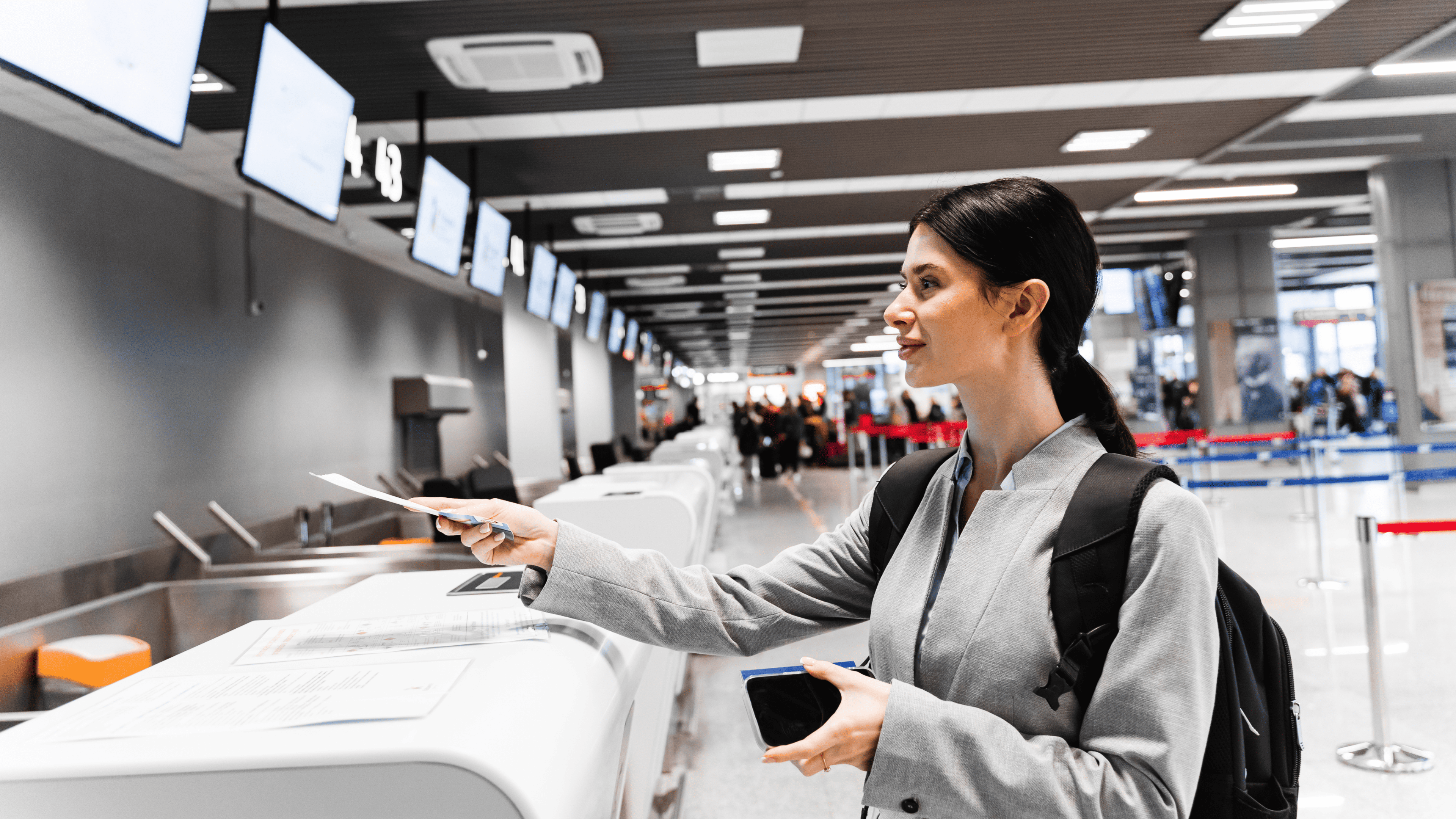 woman buy ticket at the airport