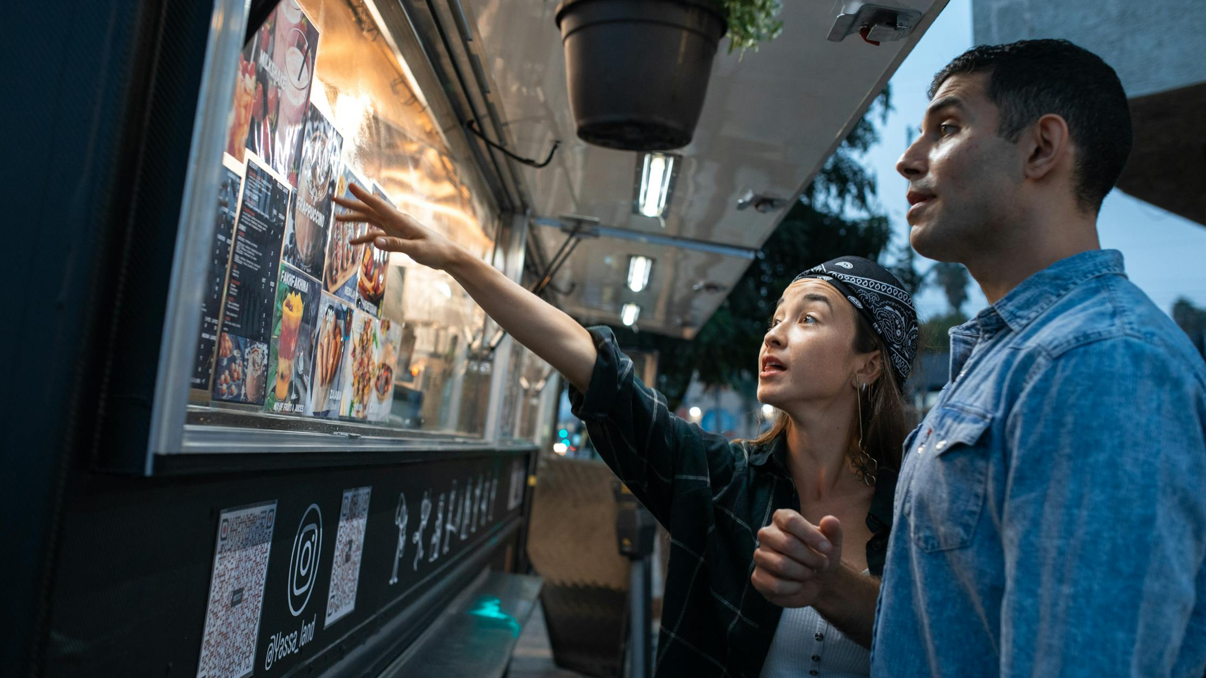 man and woman looking at upcoming events