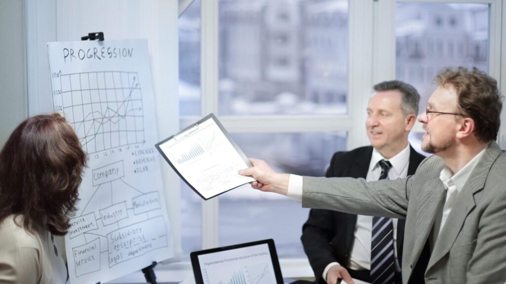 Executive team reviewing advanced analytics